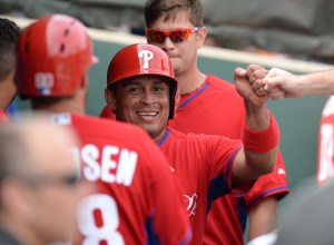 Carlos Ruiz comes into the dugout after scoring a run Tuesday in Clearwater.